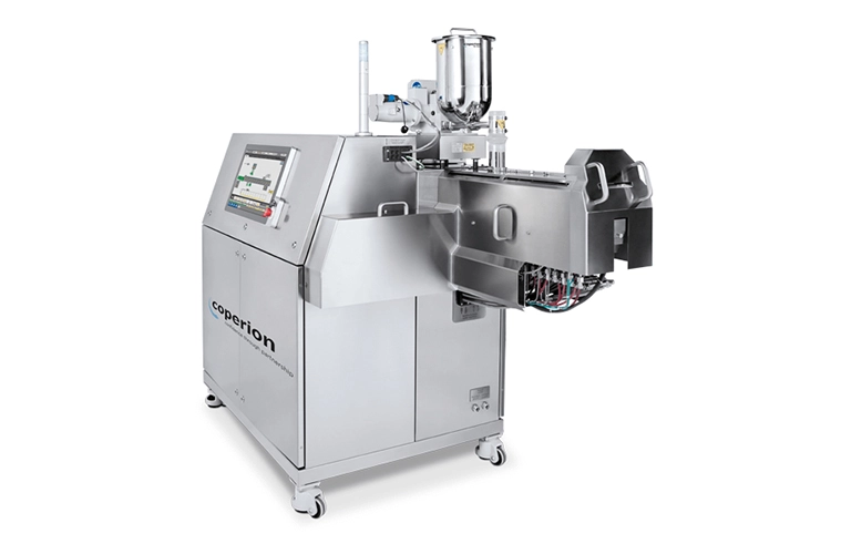 Coperion K-Tron twin screw feeder on a Coperion ZSK pharma extruder